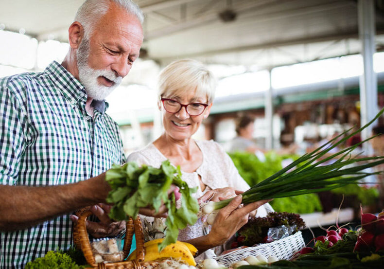 senior couple shops while discussing their long-term care policy
