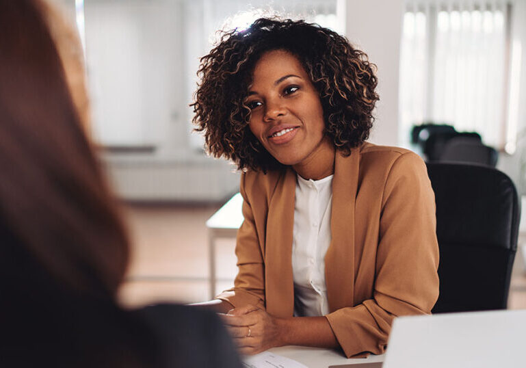 woman speaks to female estate planning attorney