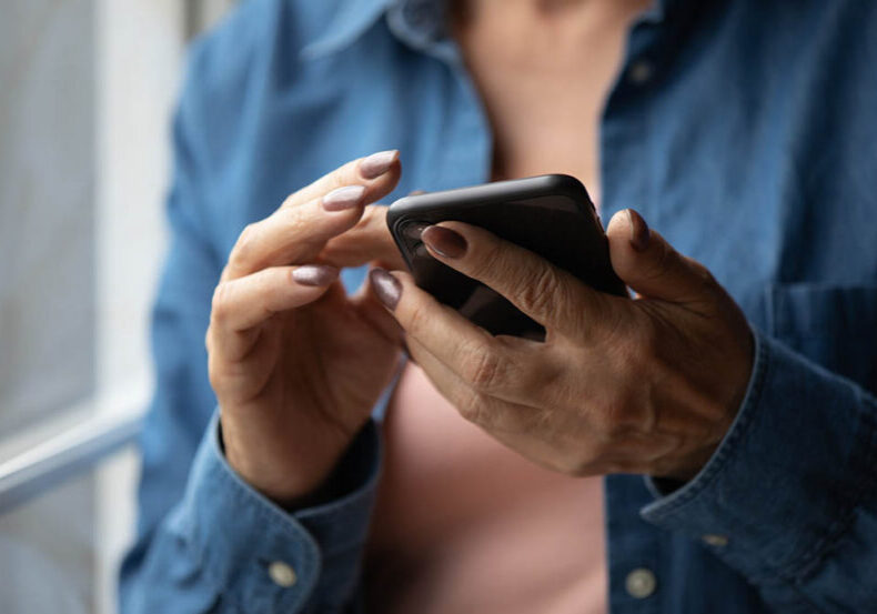 Woman uses her phone to create a legacy contact