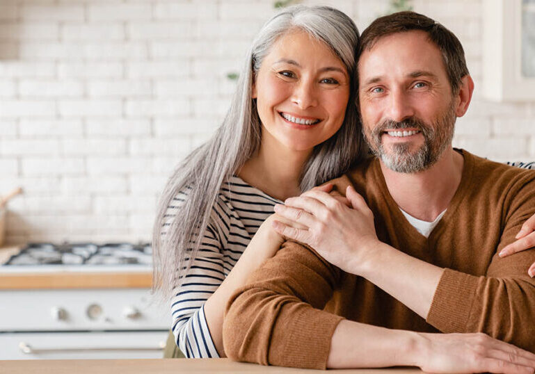 Happy couple employs asset protection strategies despite not being wealthy
