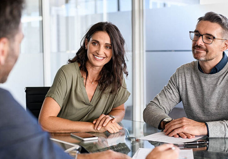 Couple speaks with advisor to learn more about pledged asset lines of credit