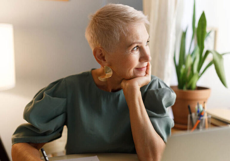 Thoughtful senior woman considers the concept of opportunity cost