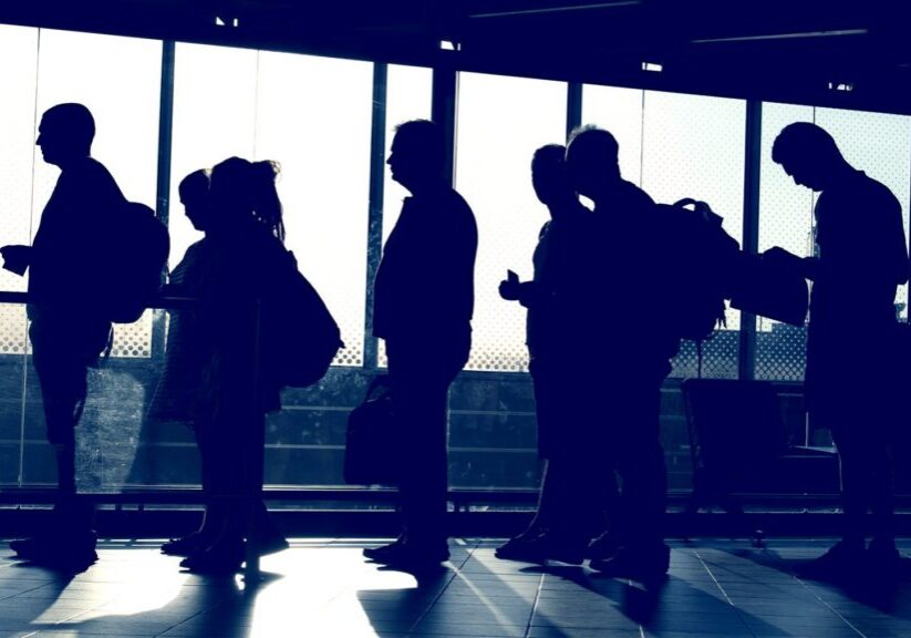 Passengers in line waiting to board plane